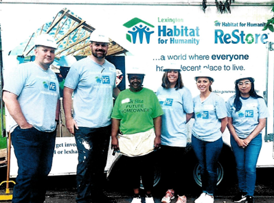 Photo of attorneys Hicks and Funfsinn at a Lexington Habitat for Humanity event.