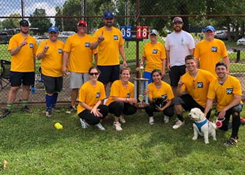 Photo of the Hicks & Funfsinn legal team with first place trophy from the 2018 Lexington Lawyer Softball League in Lexington.